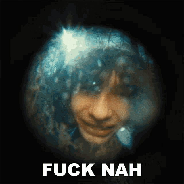 a close up of a person 's face with the words " fuck nah " above it