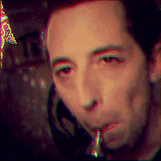 a blurry picture of a man smoking a pipe