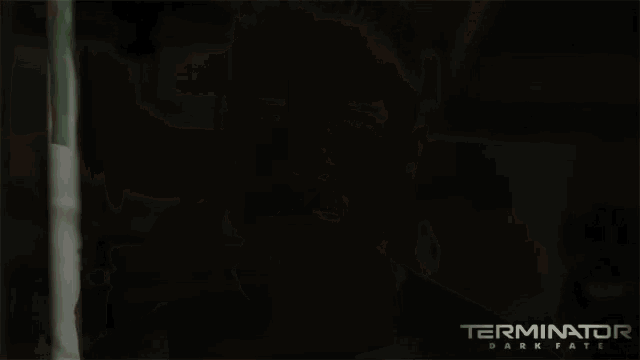 a poster for terminator dark fate features a woman