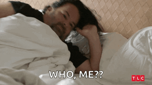 a man laying on a bed with the words who me written on the bottom