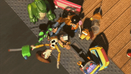 a bunch of toy story characters are laying on the ground