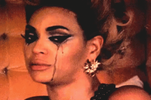 a woman with tears running down her face