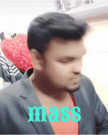 a man in a suit has the word mass written on his shirt