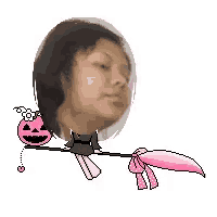 a woman is sitting on a broom with a pumpkin in her hair .