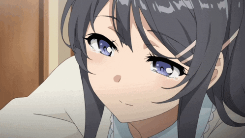 a close up of a girl 's face with blue eyes