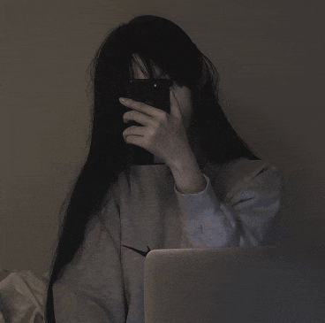 a girl with long black hair is taking a picture of herself