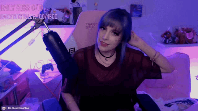 a girl with blue hair is sitting in front of a microphone with the words daily subs 0/10 daily bits talk 4/100/4500
