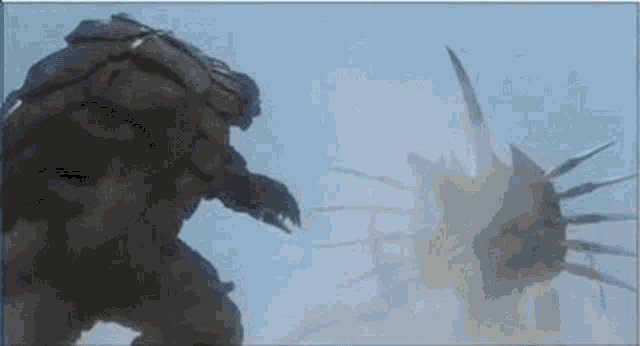 a giant monster is fighting another monster in a video game .