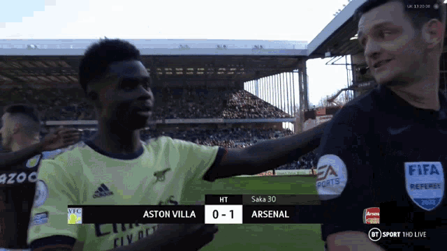 a soccer game between aston villa and arsenal is being played