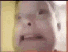 a close up of a person 's face with a blurry background .