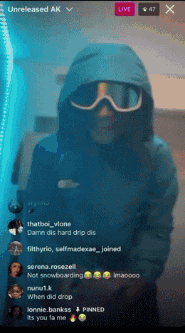 a person wearing a hooded jacket and goggles is on a live video