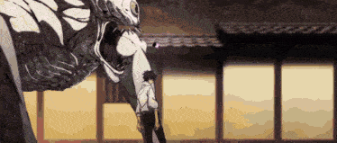 a man is standing in front of a monster with its mouth wide open