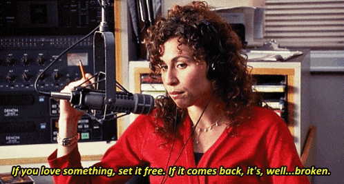a woman wearing headphones is talking into a microphone with the words if you love something set it free written below her