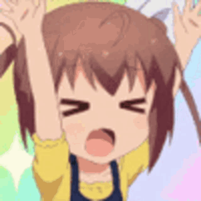 a close up of a girl with her hands in the air making a funny face .