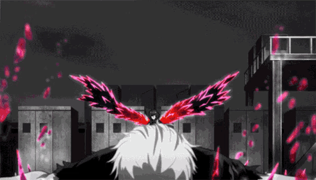 a person with wings on their head is laying on the ground in front of a building .