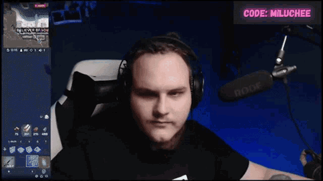 a man wearing headphones and a shirt that says send nudes is giving a peace sign