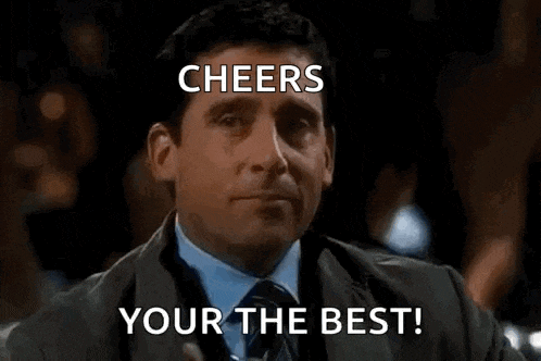 a man in a suit and tie is holding a glass of whiskey and toasting with the words cheers your the best .