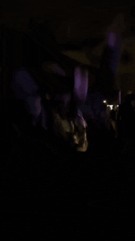 a blurry picture of a man in a black shirt that says ' i love you '