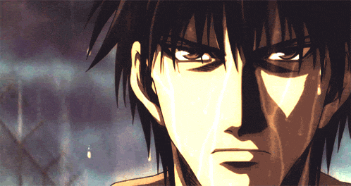 a close up of a man 's face with a tear running down his face