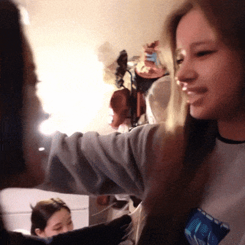 a woman wearing a shirt that says ' nc ' on it