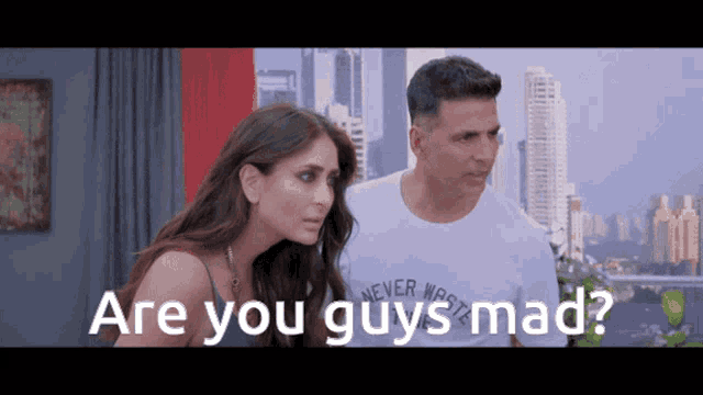 a man and a woman are standing next to each other and the man is wearing a shirt that says never work
