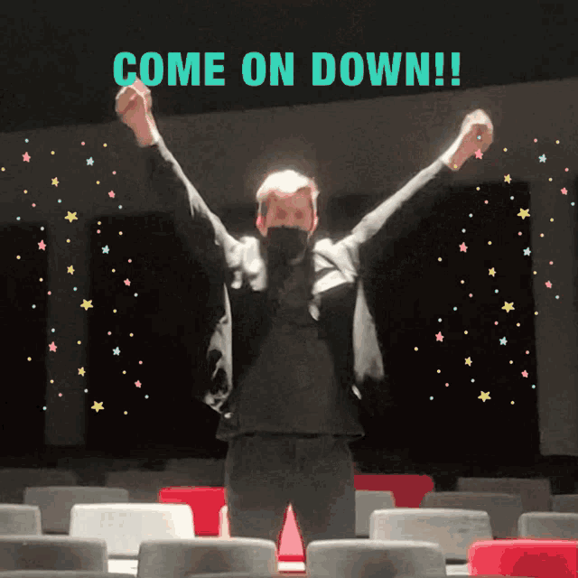 a man with his arms in the air with the words come on down below him