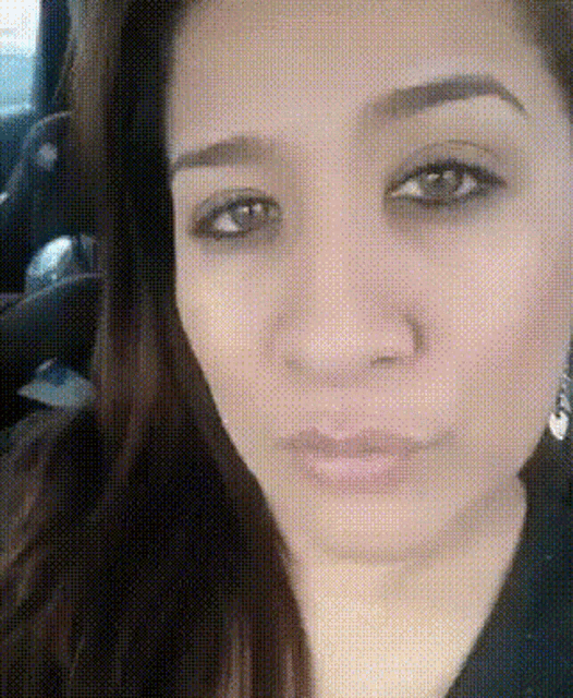 a close up of a woman 's face with a grid pattern