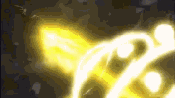 a close up of a yellow light coming out of a circle on a dark background .