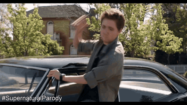 a man getting out of a car with #supernatural parody written below him