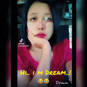 a woman in a pink shirt says hi i 'm dream !