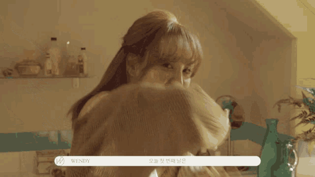 a woman with the name wendy on her chest
