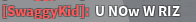 a blurred image of a sign that says ' swaggy kid uno w riz '