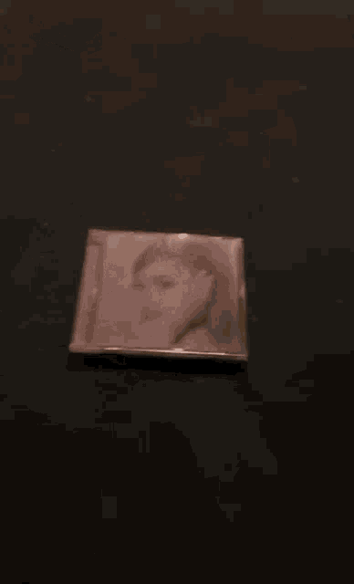 a picture of a woman 's face is being thrown on a table .