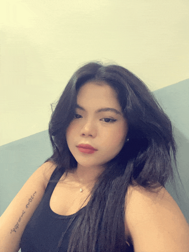 a woman has a tattoo on her arm that says ' i love you '