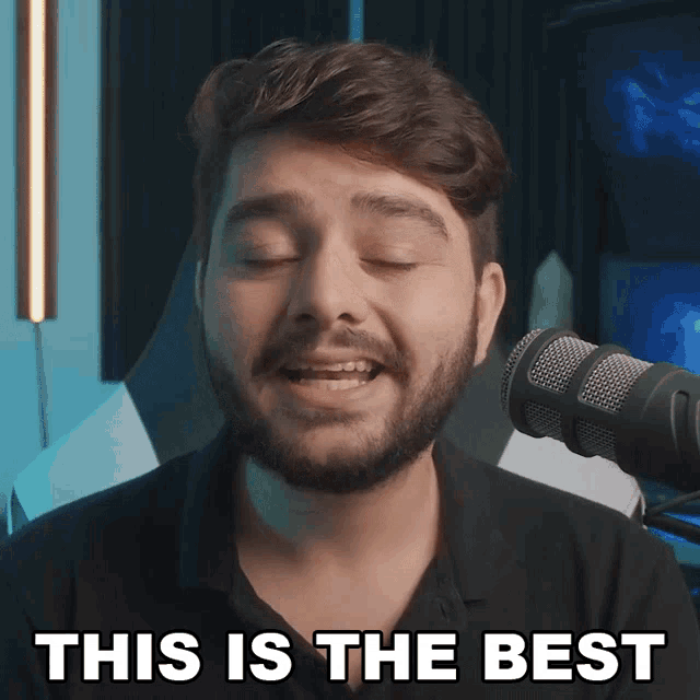 a man with a beard singing into a microphone with the words this is the best below him