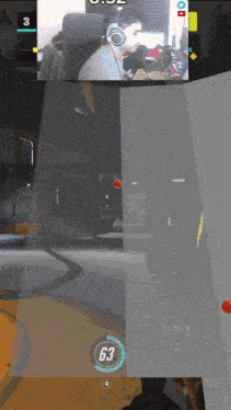 a man wearing headphones is playing a video game and the time is 0:02
