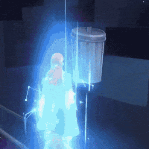 a person is standing in front of a trash can that is glowing blue