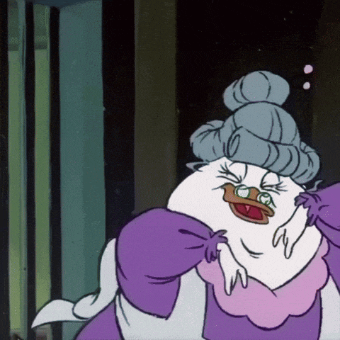 a cartoon duck is wearing a purple apron and a gray hat