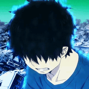 a boy with black hair and a blue shirt is standing in front of a pile of rubble