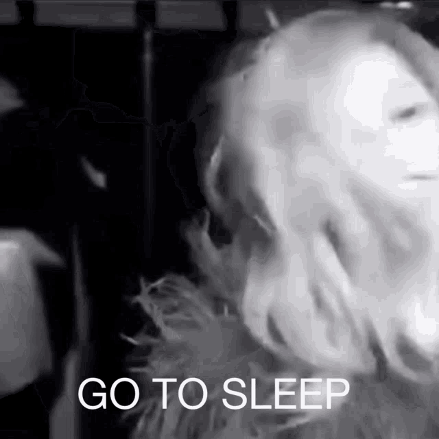 a black and white photo of a woman with the words go to sleep on the bottom