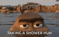 a cartoon character with horns is taking a shower in a body of water .