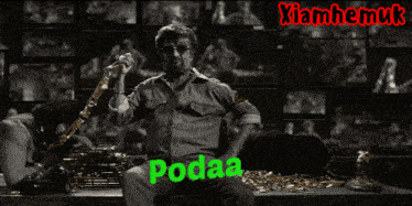 two men sit at a table with the word podaa in green