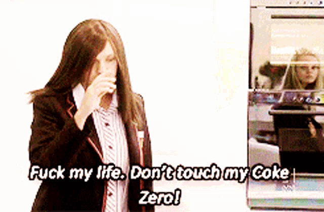a woman talking on a cell phone next to a sign that says " fuck my life "