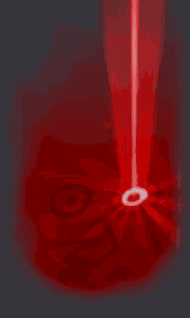 a red object with a white circle in the middle