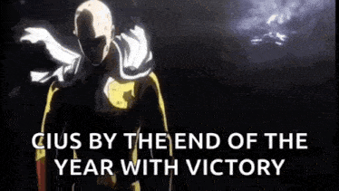 a man is standing in the dark with the words `` cius by the end of the year with victory '' written on the screen .
