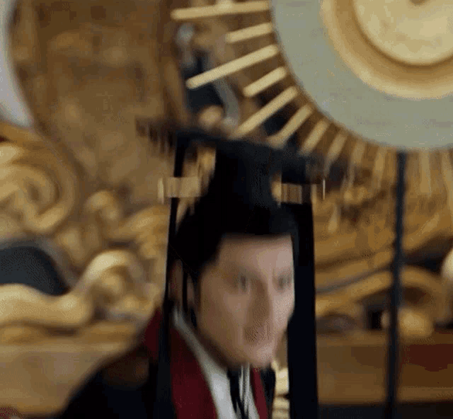 a blurry picture of a man wearing a black hat and a red jacket