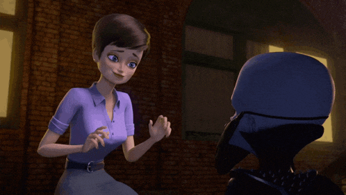 a woman in a purple shirt is talking to a man in a black helmet