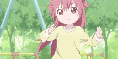 a little girl with pink hair and a yellow shirt stands in front of a swing set