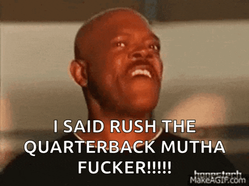 a bald man is laughing and saying " i said rush the quarterback mutha fucker !!! "