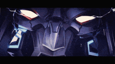 a close up of the face of a robot with red eyes